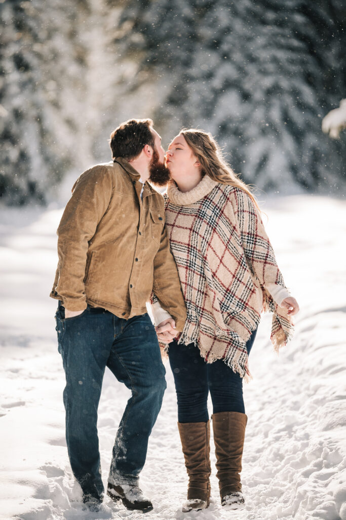 Engagement portrait in falling snow by Charles Moll