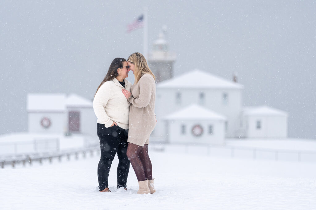 Simple snowy backdrop engagement portrait by BridgetQ Photography