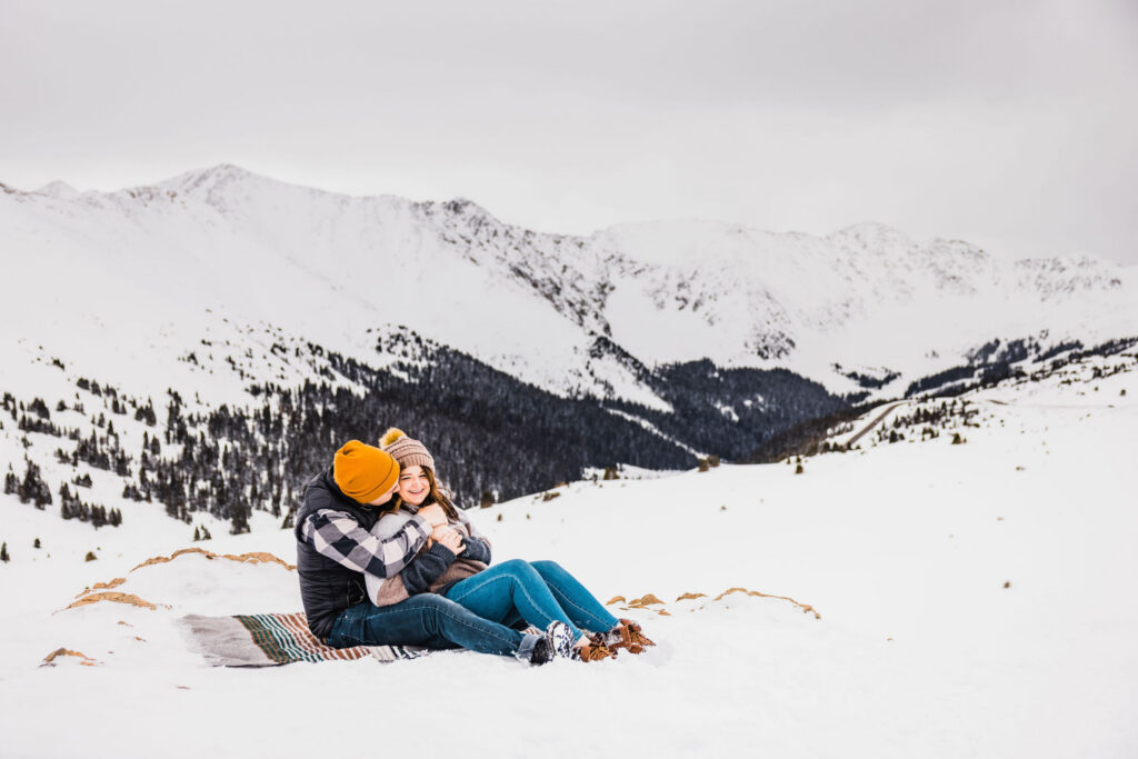Bold winter engagement portrait with color contrast by Vow of the Wild
