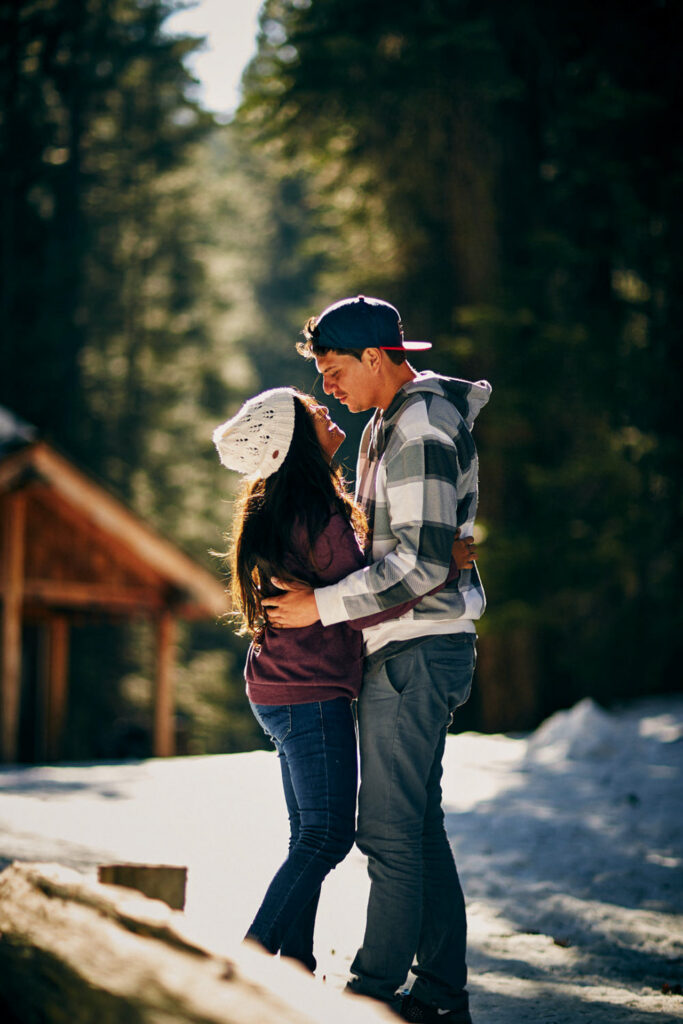Vertical winter engagement portrait by Crissorama
