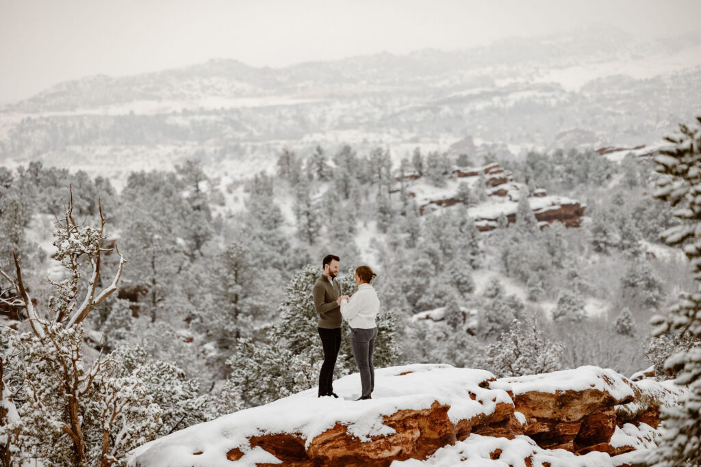Clean snowy backdrop engagement portrait by In Love and Adventure