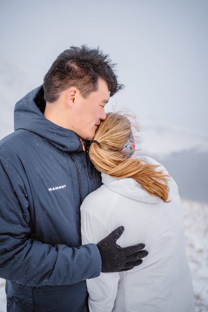 Mountain winter engagement portrait by Vows and Peaks